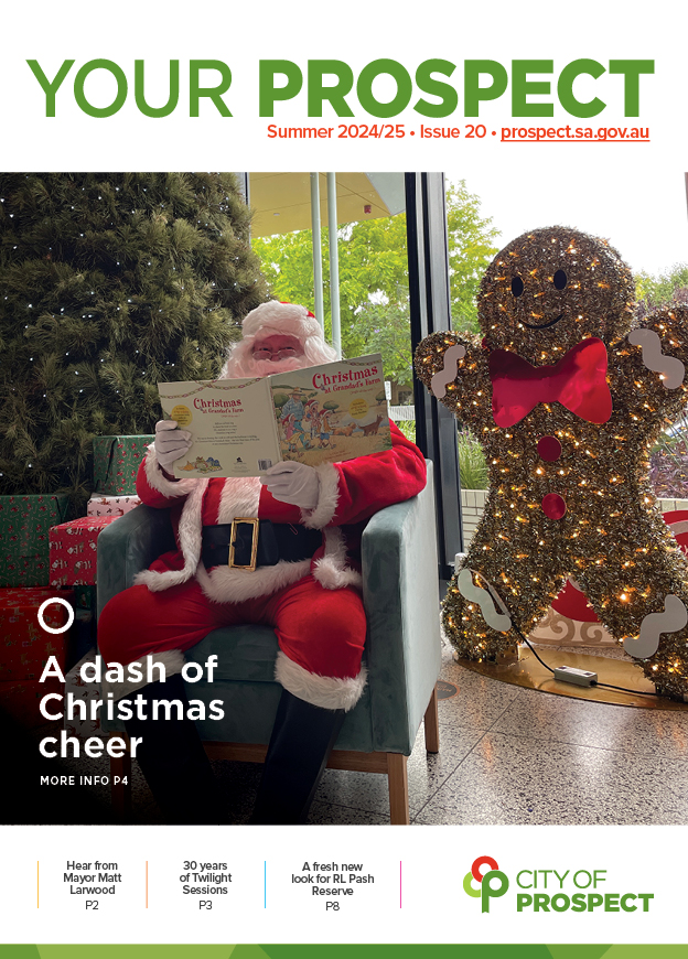 Santa Claus reading a book under the Christmas tree at Payinthi