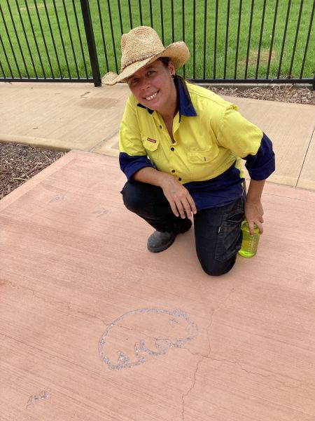 Image of artist Christine Chowela working on the public art installation at Percy Street Reserve