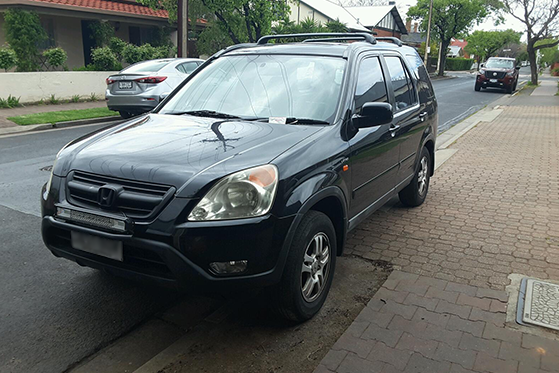 Example of stopping on or across a driveway